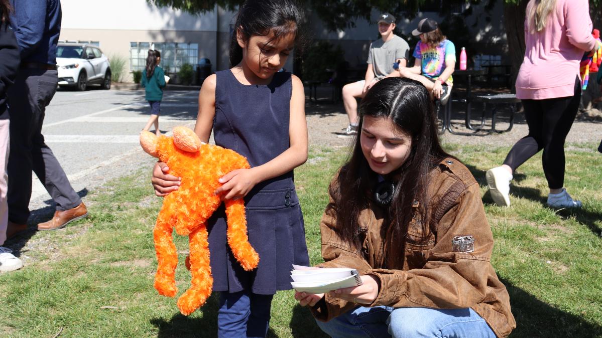 Young lady reading to a child.