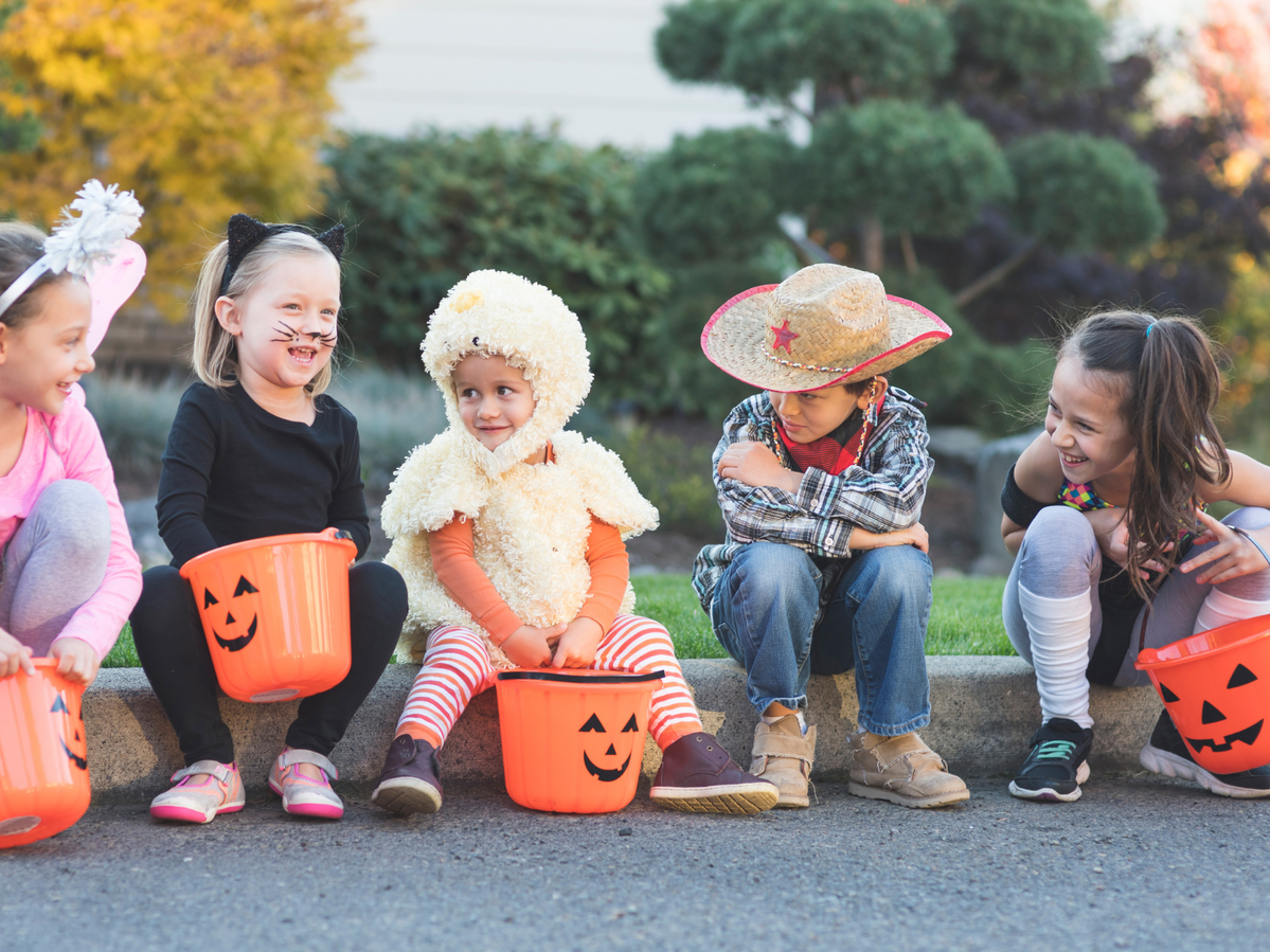 Children dressed up in Halloween costumes.