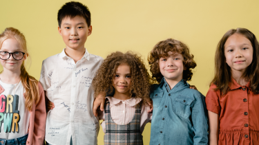 Five students posing for photo.
