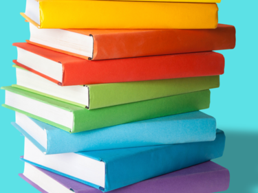 A stack of rainbow-coloured books.