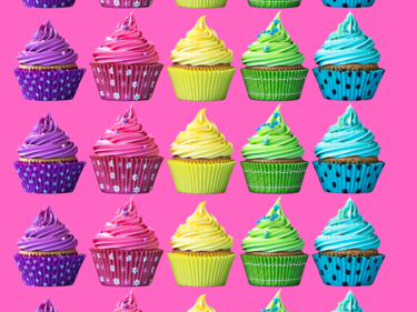 Rainbow coloured cupcakes.