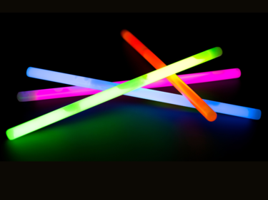 Coloured glow sticks in a pile.