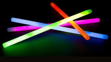 Ilumi Dance Presentation Coloured glow sticks in a pile.