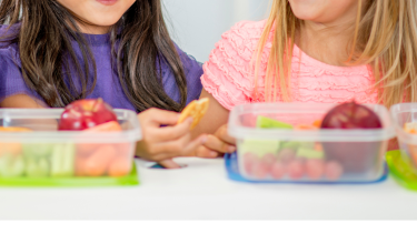 Two students eating lunch together.
