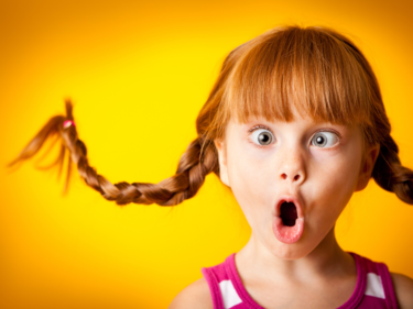 A girl with curled up pigtail braids.