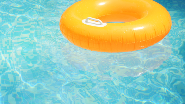 A yellow innertube in a light blue pool.