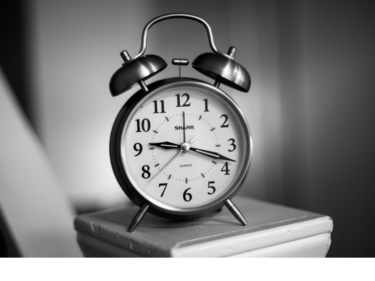 Black and white photo of an alarm clock.