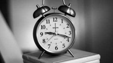 Black and white photo of an alarm clock.