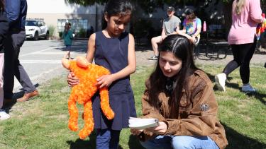 Young lady reading to a child.