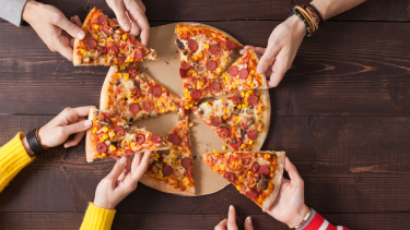 Hot Lunch - Pizza Hut Children reaching for slices of pizza.