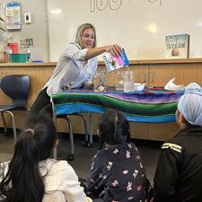 Teacher working with students in the LLC.