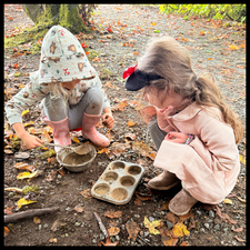 Students playing in the dirt.