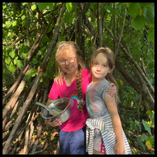 Two students playing in the forest.
