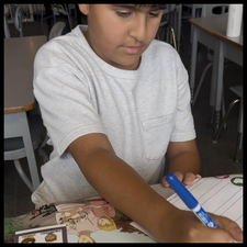 A student reading and taking notes.