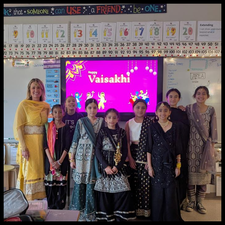 A group of students and their teacher, dressed up for Vaisakhi.